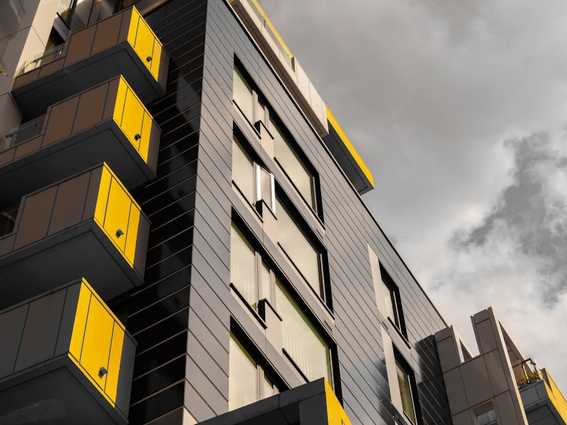 Asset manager reviewing multi-site asset registry and depreciation reports